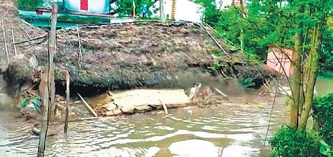 A submerged thatched house in Chahapada village. (Photo  | Express)