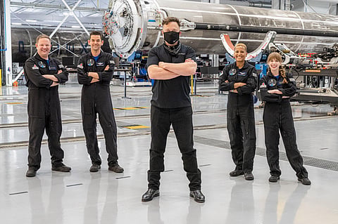 Elon Musk, front center, poses with the all-amateur crew before departure to Launch Complex 39A for a launch into space, Wednesday, Sept. 15, 2021, at Kennedy Space Center. (Photo | AP)
