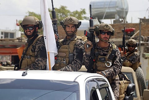 Taliban special force fighters arrive inside the Hamid Karzai International Airport after the U.S. military's withdrawal. (Photo | AP)