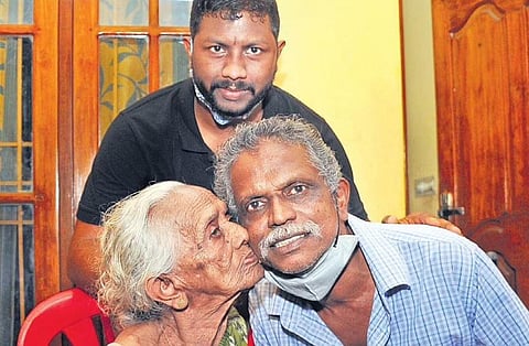 Jayapalan sharing the joyous moment with his mother Lakshmi and son Vysakh at their residence at Maradu in Kochi on Monday  | A Sanesh