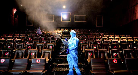 Workers disinfecting a multiplex. (File | EPS)
