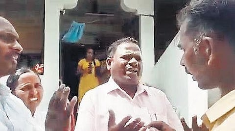 One of the accused, Jemsa (centre), argues with villagers of Neelahalli on Sunday