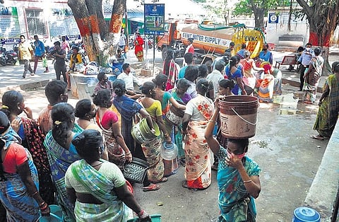Long queue of patients and attendants before water tanker at the blocks where water supply was hampered at KGH in Vizag on Saturday. (Photo | I G Satyanarayana)