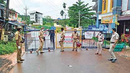 Cops close down a road at Chathamangalam in Kozhikode after a fresh Nipah outbreak was reported