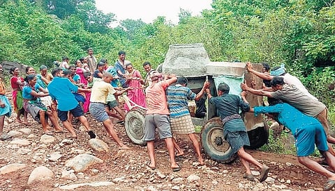 Tribals take a concrete mixer to their hilltop village Vanakabadi in Vizianagaram district  | EXPRESS