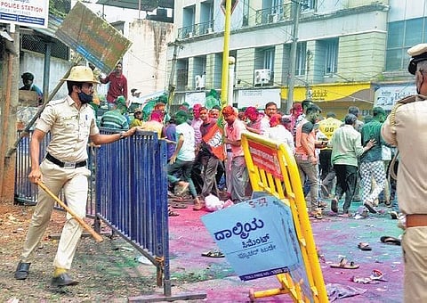Police barricade the area outside a counting booth in Belagavi on Monday