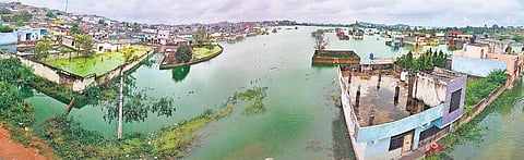 A residential locality under water after five days of heavy rain, at Osman Nagar in Hyderabad on Monday (Photo | VIinay Madapu)