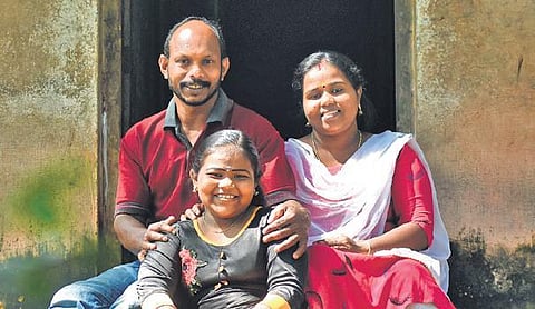 Devipriya with her parents Jayachandran G  and Rekha in front of their house at Mangattumoola near Attingal | B P Deepu
