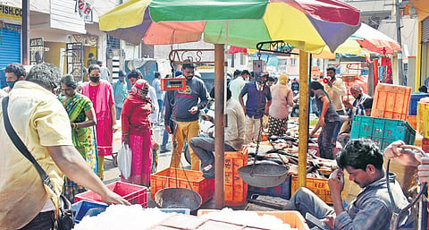 While the State is witnessing a spike in Covid cases, many still don’t wear masks at Ram Nagar Fish Market(Photo | S Senbagapandiyan)