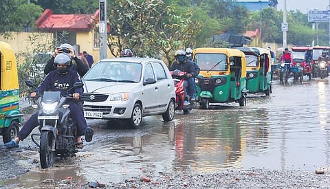 Vehicles on a waterlogged street after rain in New Delhi . (Photo| PTI)