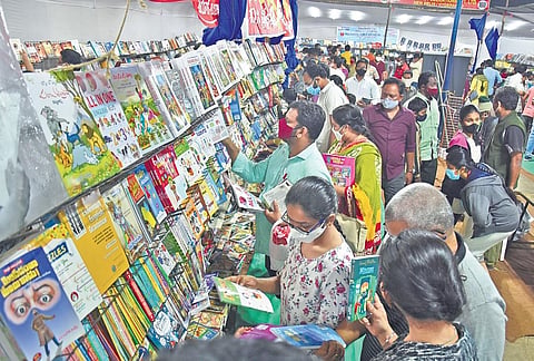 People looking through books on the last day of the 32nd Book Festival at  PWD Grounds in Vijayawada on Tuesday, Jan 11, 2022. (Photo | EPS, P Ravindra Babu)