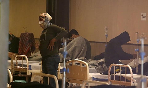 Covid-19 infected patients inside the Covid Care Centre at Shahnai Banquet hall in New Delhi on Wednesday. (Photo | Parveen Negi/EPS)