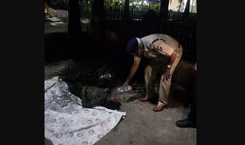 Railway Protection Force personnel offering water to the woman abandoned at KSR railway station in Bengaluru by her family (File Photo | EPS)
