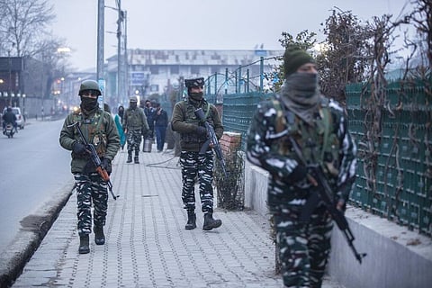Indian paramilitary soldiers patrol at a closed market during a weekend lockdown in Srinagar, Indian controlled Kashmir, Sunday, Jan. 16, 2022. (Photo | AP)