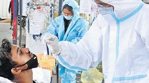 A health worker collects swab samples of a man in Bengaluru.  (File photo)