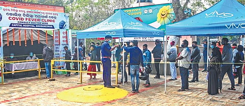 Patients with Covid-19 symptoms wait at the Covid Fever Clinic on Capital Hospital premises in Bhubaneswar (File Photo I Express)