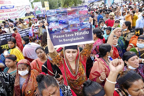Bangladeshi Hindus protesting in Dhaka against attacks on temples and the killing of two Hindu devotees.(File Photo | AP)