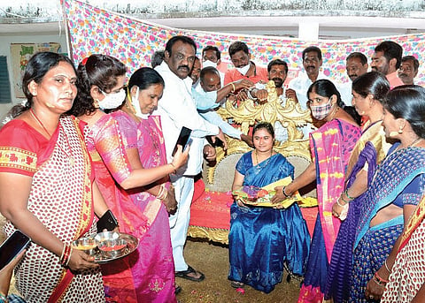 Nustulapur sarpanch Ravula Ramesh at a Srimantham programme organised by him.
