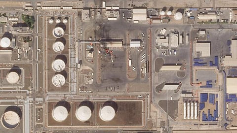 This satellite image provided Planet Labs PBC shows the aftermath of an attack claimed by Yemen's Houthi rebels on an Abu Dhabi National Oil Co. fuel depot in the Mussafah neighborhood. (Photo | AP)
