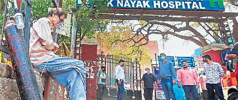 A COVID-19 patient waits for his admission outside Lok Nayak Hospital, Jawaharlal Nehru Marg, as cases spike in New Delhi. 