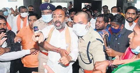 Police take BJP State president Bandi Sanjay Kumar into custody  from his office in Karimnagar on Sunday.