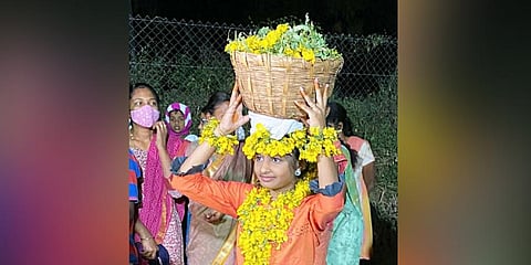 ‘Nila Penn’ V Pratiksha adorned with Aavaaram flowers at Kottur village on January 18 | Express