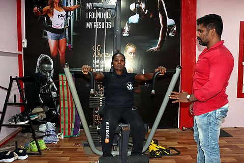 S Sangeetha hitting the gym; her gym master M Kumaravel giving instructions | S Dinesh
