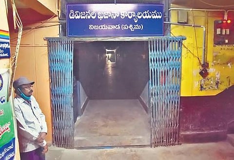An employee at divisional treasury office at Governorpet in Vijayawada on Sunday.  No one else turned up at the office for work till 11.35 am I P Ravindra Babu