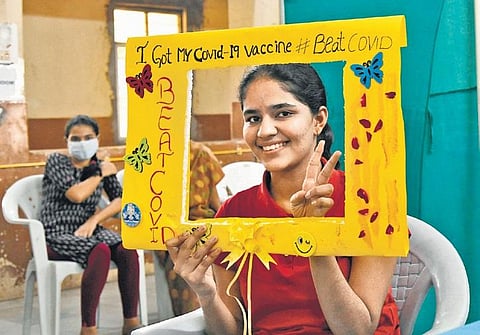 A young girl poses for a picture after taking Covid vaccine at Fever Hospital  in Hyderabad on Monday, Jan 3, 2022. (Photo | EPS, Vinay Madapu)