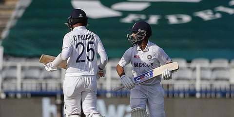 Cheteshwar Pujara (L) and Ajinkya Rahane hit half-centuries on Day 3 | AFP