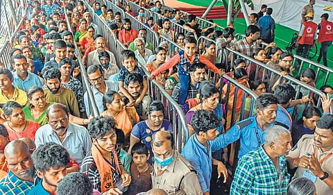 Devotees wait in queue lines to have darshan of Goddess Kanaka Durga in Lalita Tripura Sundari Devi Avatar (top right) on the fifth day of Dasara festivities in Vijayawada on Friday | Prasant M