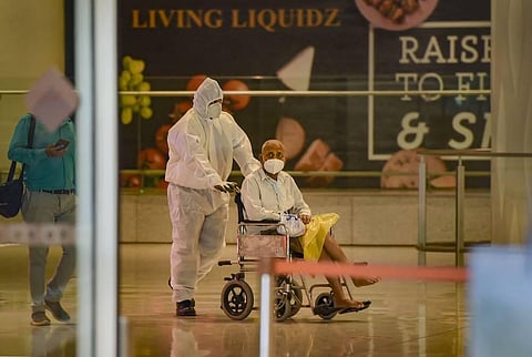 A senior citizen wheeled out from Mumbai international airport. (File Photo | PTI)