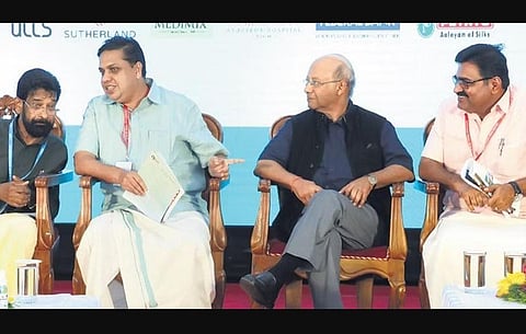 Speaker A N Shamseer having a word with GCDA chairman K Chandran Pillai at the valedictory function of Bodhi-2022. Keshav Varma of MoUHA and Kochi Mayor M Anilkumar look on | Express