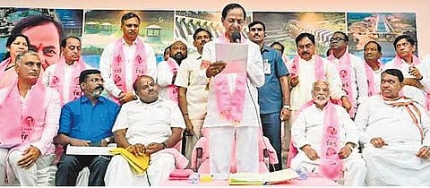 TRS chief K Chandrashekar Rao reads a resolution of the party’s general body to change its name to Bharat Rashtra Samithi, in Hyderabad on Wednesday. (Photo | PTI)