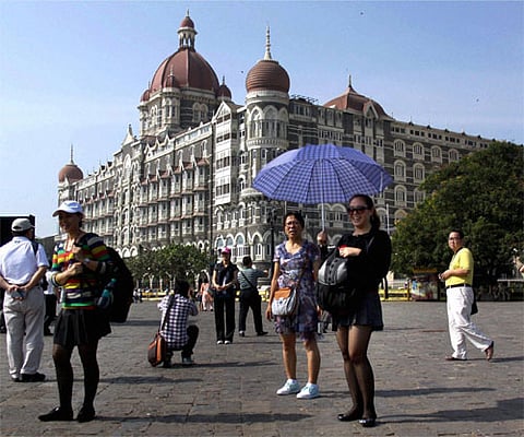 Tourists outside the Taj Hotel, one of the targets during the 26/11 terror attacks, in Mumbai. (File | PTI)