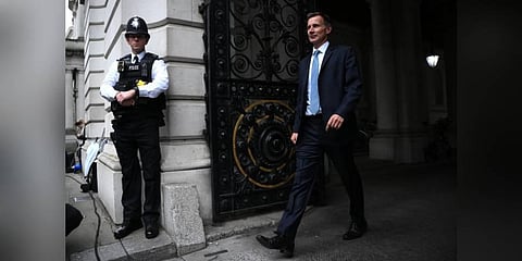 Britain's new Chancellor of the Exchequer Jeremy Hunt arrives in Downing Street in central London. (Photo | AFP)