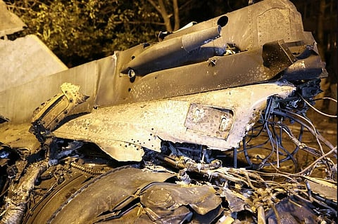 The wreckage of a Sukhoi Su-34 military jet lie at the crash site in the courtyard of a residential area in the town of Yeysk in southwestern Russia on October 17, 2022.  (Photo | AFP)