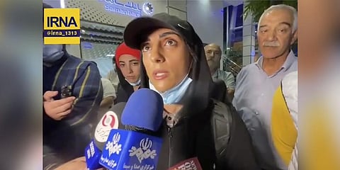 In this image taken from video by Iran's state-run IRNA news agency, Elnaz Rekabi speaks to journalists in Imam Khomeini International Airport in Tehran.Oct. 19, 2022. (Photo | AP)