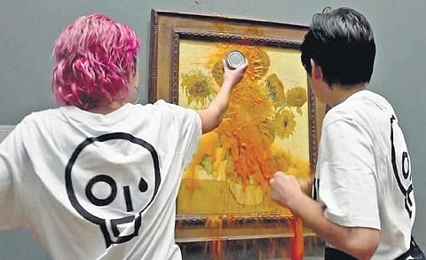 Climate activists  throw tomato  soup on Vincent van Gogh’s painting ‘Sunflowesr’ in London