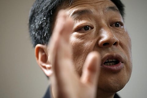 Wang Zhi'an speaks during an interview with the Associated Press in Tokyo on Oct. 5, 2022. (Photo | AP)