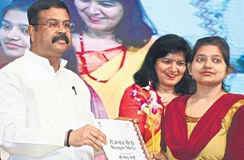 Union Minister Dharmendra Pradhan handing out appointment letter at Rojgar Mela in Bhubaneswar | Shamim Qureshy