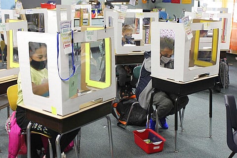 In this Oct. 19, 2020, file photo Michigan City, Ind., area school students return for in-person instruction after two months of remote learning to start the new school year.  (Photo | AP)