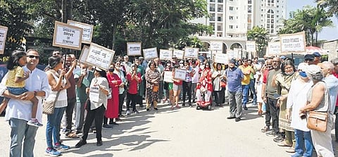 Residents of Prestige Kensington Gardens protest against bad roads and potholes in Jalahalli in Bengaluru on Sunday | Nagaraja Gadekal