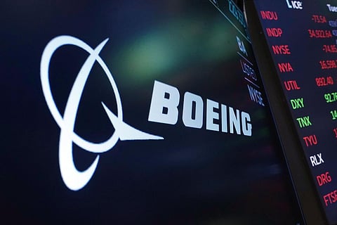 The logo for Boeing appears on a screen above a trading post on the floor of the New York Stock Exchange. (File Photo | AP)