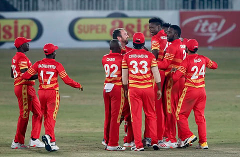 Zimbabwe's pacer Blessing Muzarabani, third right, celebrates with teammates after taking the wicket of Pakistani batsman Babar Azam at the Pindi Cricket Stadium, in Rawalpindi, Pakistan. (Photo | AP)