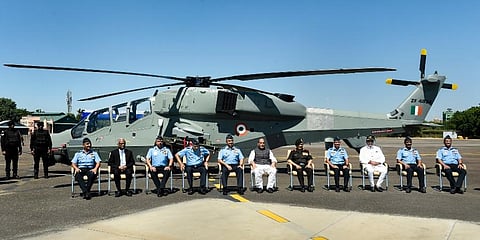 Union Defence Minister Rajnath Singh with Chief of Defence Staff General Anil Chauhan  and others during a ceremony to induct the first batch of indigenously developed LCH. (Photo | PTI)