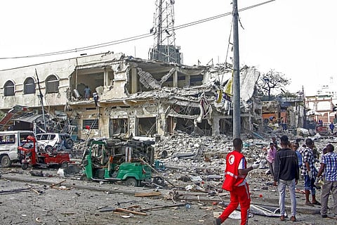 Rescuers remove a seriously-injured body from the scene of a double car-bomb attack in the capital Mogadishu, Somalia Saturday, Oct. 29, 2022.  (Photo | AP)