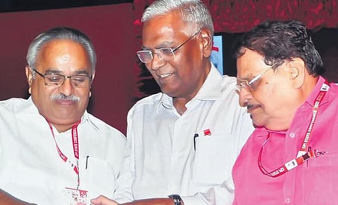 CPI general secretary D Raja asking rival leaders KE Ismail and Kanam Rajendran to shake hands with each other, after the party state conference at Tagore Theatre on Monday | BP Deepu