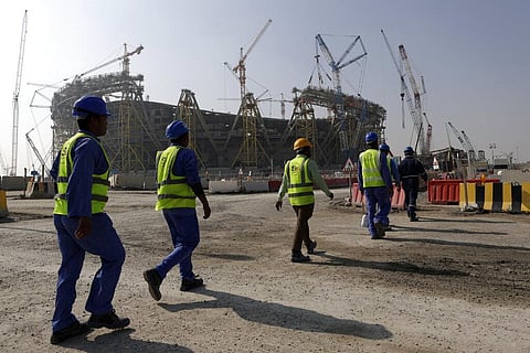 Workers walk to the Lusail Stadium, one of the 2022 World Cup stadiums, in Qatar, Dec. 20, 2019. (File Photo | AP)