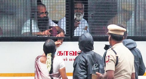 Nalini and her husband Murugan, who was released from jail in the former PM Rajiv Gandhi assassination case, hold hands outside Vellore jail on Saturday 